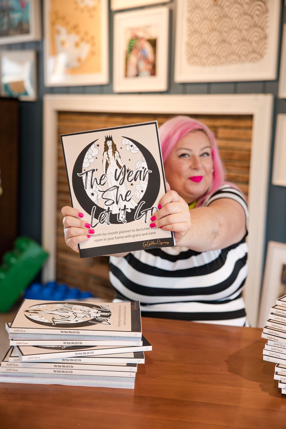 Unison holding up The Year She Let It Go planner